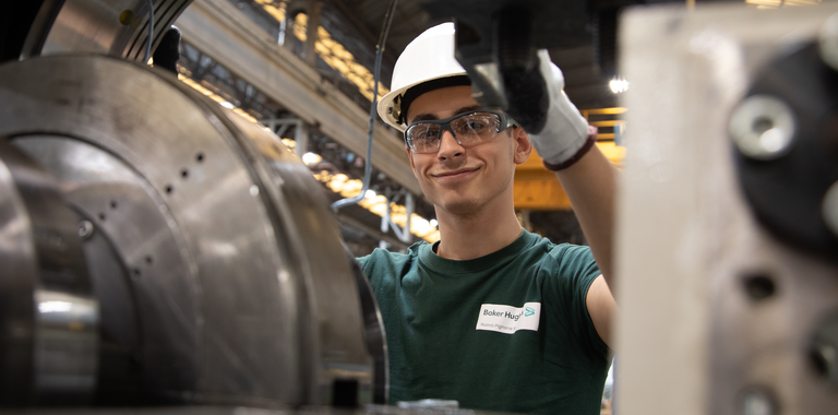 Baker Hughes worker in the shop. Baker Hughes worker in the shop.