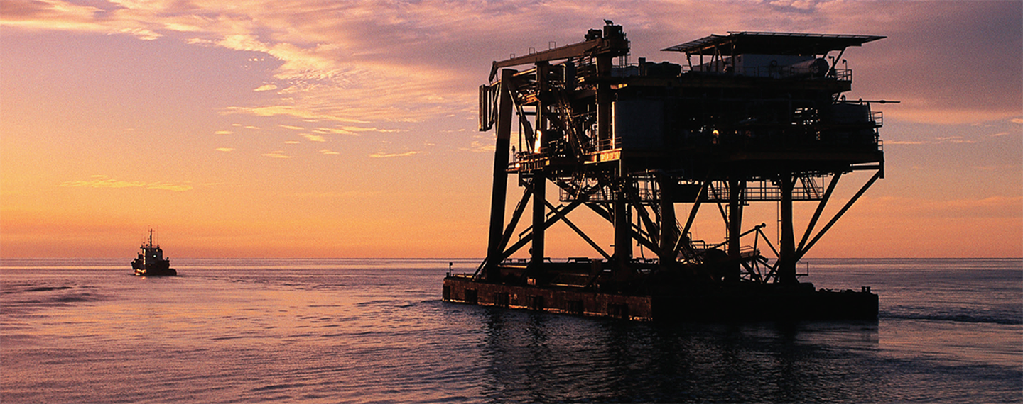 Photo of a decommissioned rig offshore.