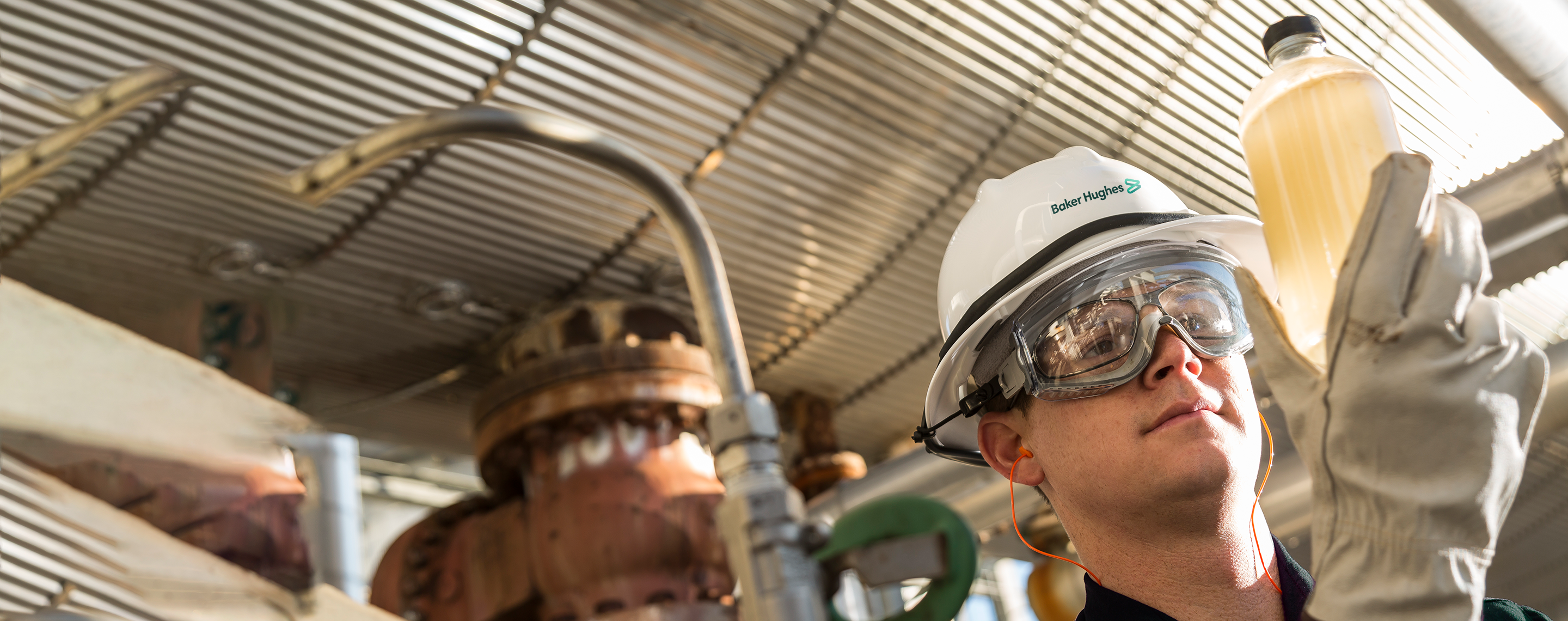 Photo of a Baker Hughes chemical engineer in the field.