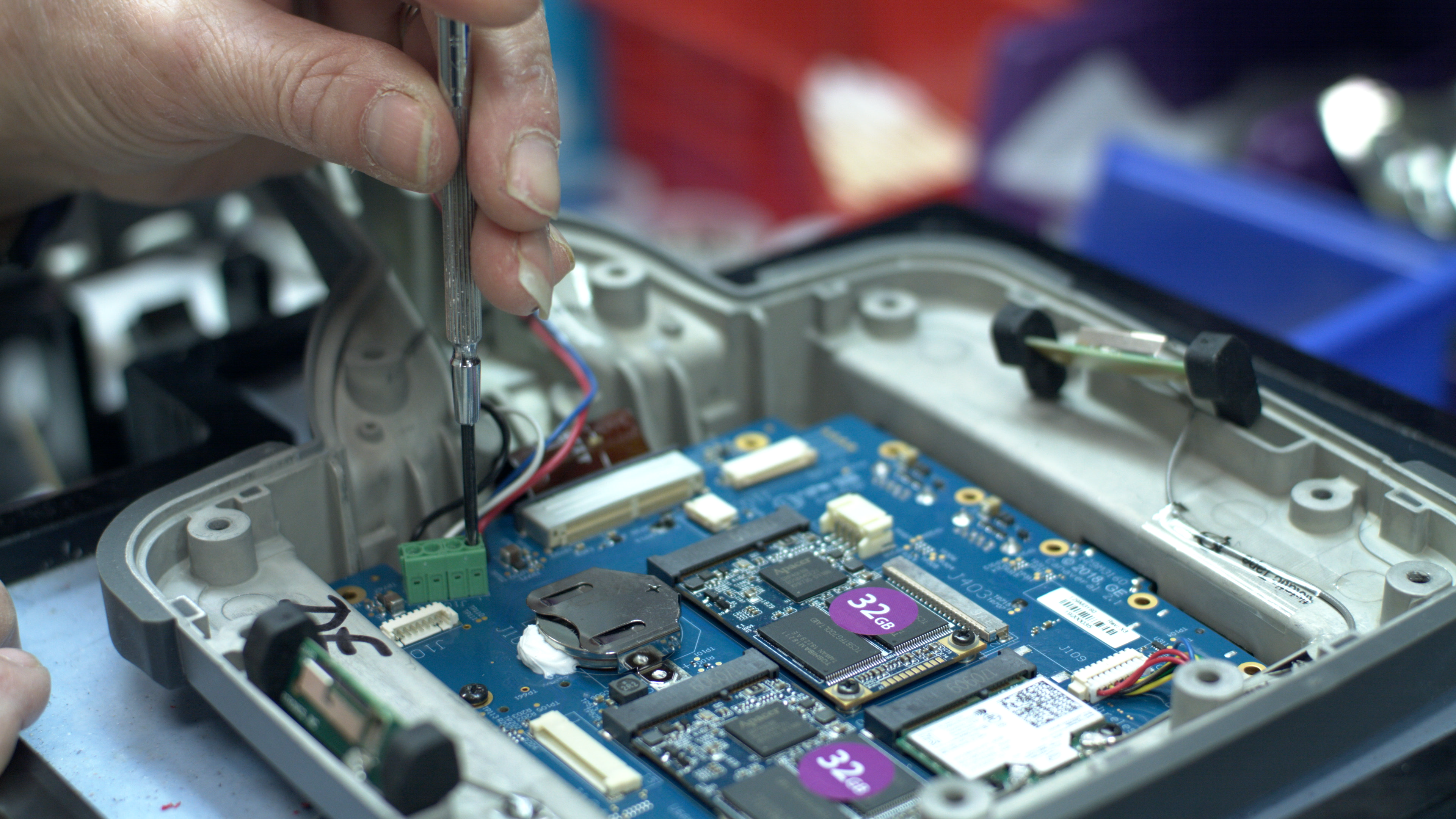 In-house video borescope repair process of fixing behind the screen of the MViQ videoprobe.