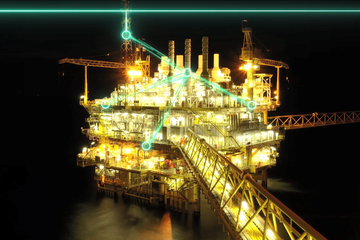 Night time photo of an offshore oil rig.