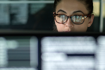 Woman looking at a computer screen.