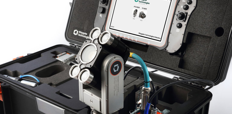Close up images of ca-zoom inspection camera head sticking out of its transport case with the handheld tablet for navigation on the case's open lid.