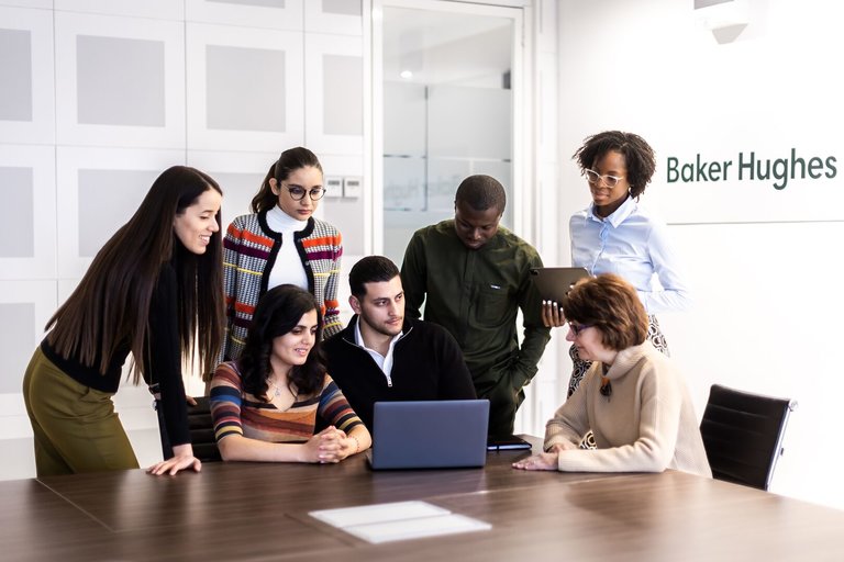 People at a table at Baker Hughes